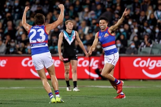 Laitham Vandermeer and Jason Johannisen of the Bulldogs celebrate a goal during the 2021 AFL Second Preliminary Final match between the Port Adelaide...