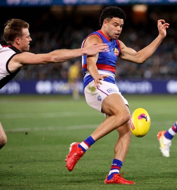 Tom Jonas of the Power tackles Jason Johannisen of the Bulldogs during the 2021 AFL Second Preliminary Final match between the Port Adelaide Power...