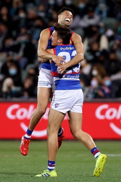 Laitham Vandermeer and Jason Johannisen of the Bulldogs celebrate a goal during the 2021 AFL Second Preliminary Final match between the Port Adelaide...