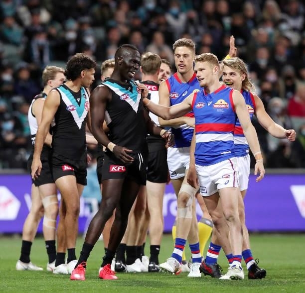 Bit of push and shove between Aliir Aliir of the Power and Adam Treloar of the Bulldogs during the 2021 AFL Second Preliminary Final match between...