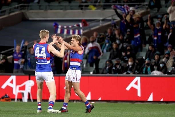 Tim English and Bailey Smith of the Bulldogs celebrate a goal during the 2021 AFL Second Preliminary Final match between the Port Adelaide Power and...