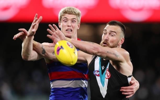 Tim English of the Bulldogs and Charlie Dixon of the Power during the 2021 AFL Second Preliminary Final match between the Port Adelaide Power and the...