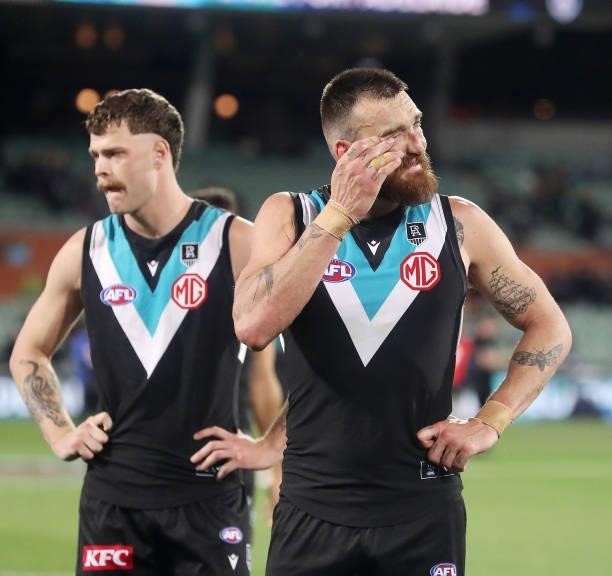 An emotional Charlie Dixon and Peter Ladhams after the loss during the 2021 AFL Second Preliminary Final match between the Port Adelaide Power and...