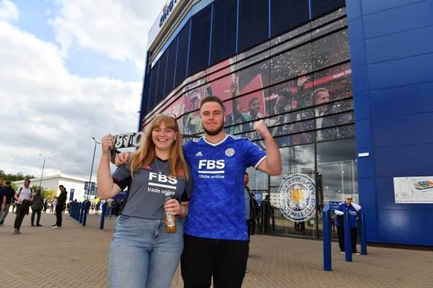 Leicester City fans arrive ahead of the Premier League match between Leicester City and Manchester City at King Power Stadium on September 11, 2021...
