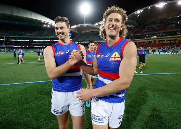Zaine Cordy and Aaron Naughton of the Bulldogs celebrate during the 2021 AFL Second Preliminary Final match between the Port Adelaide Power and the...
