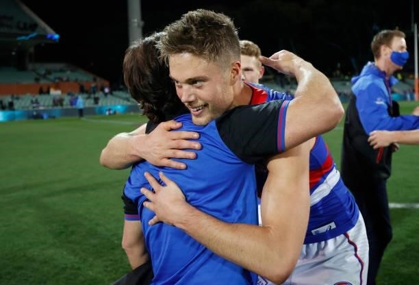 Luke Beveridge, Senior Coach of the Bulldogs and Josh Schache of the Bulldogs celebrate during the 2021 AFL Second Preliminary Final match between...