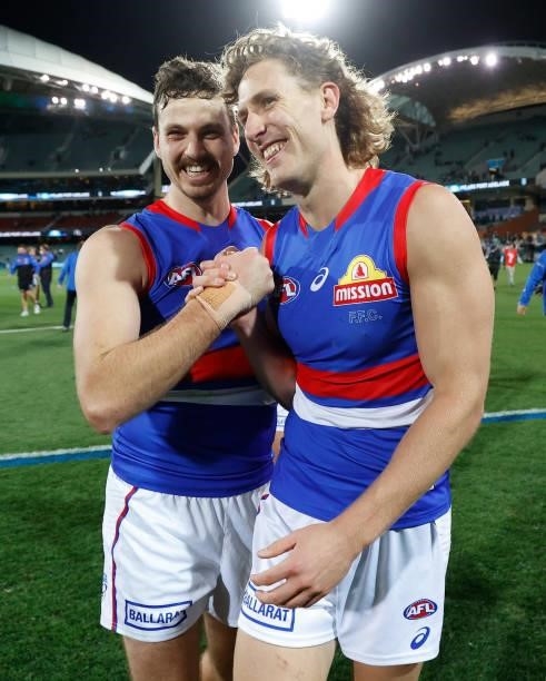 Zaine Cordy and Aaron Naughton of the Bulldogs celebrate during the 2021 AFL Second Preliminary Final match between the Port Adelaide Power and the...