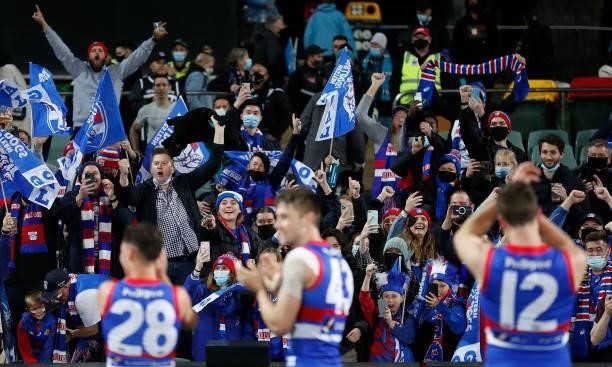 Dogs fans celebrate during the 2021 AFL Second Preliminary Final match between the Port Adelaide Power and the Western Bulldogs at Adelaide Oval on...