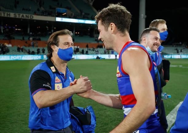 Luke Beveridge, Senior Coach of the Bulldogs and Josh Dunkley of the Bulldogs celebrate during the 2021 AFL Second Preliminary Final match between...