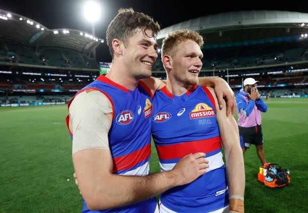 Josh Dunkley and Adam Treloar of the Bulldogs celebrate during the 2021 AFL Second Preliminary Final match between the Port Adelaide Power and the...