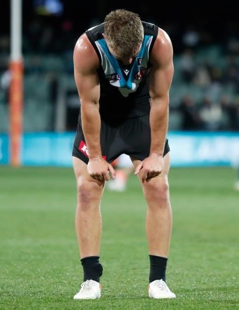 Ollie Wines of the Power looks dejected after a loss during the 2021 AFL Second Preliminary Final match between the Port Adelaide Power and the...