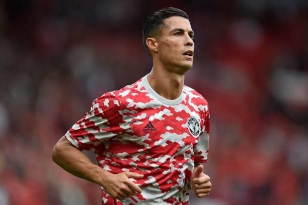 Manchester United's Portuguese striker Cristiano Ronaldo warms up ahead of the English Premier League football match between Manchester United and...