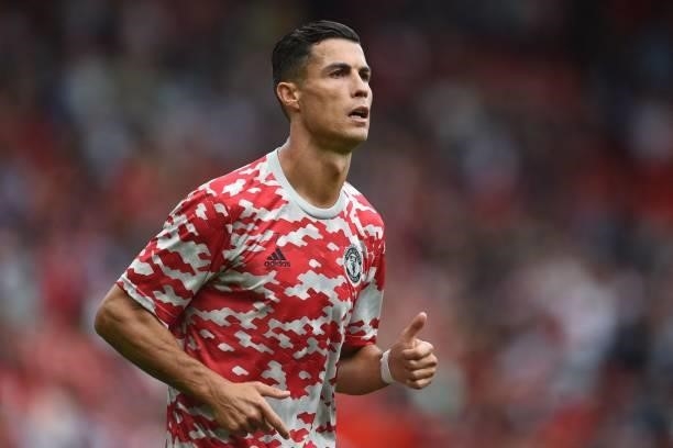 Manchester United's Portuguese striker Cristiano Ronaldo warms up ahead of the English Premier League football match between Manchester United and...