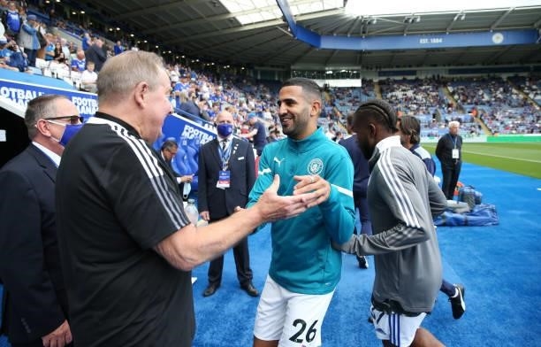 Riyad Mahrez of Manchester City reunites with Leicester City Club Ambassador Alan Birchenall ahead of the Premier League match between Leicester City...
