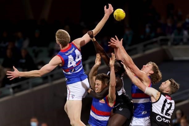Tim English of the Bulldogs clashes with Aliir Aliir of the Power during the 2021 AFL Second Preliminary Final match between the Port Adelaide Power...