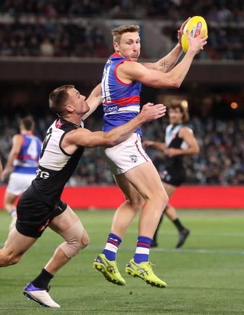 Bailey Dale of the Bulldogs marks the ball in front of Robbie Gray during the 2021 AFL Second Preliminary Final match between the Port Adelaide Power...