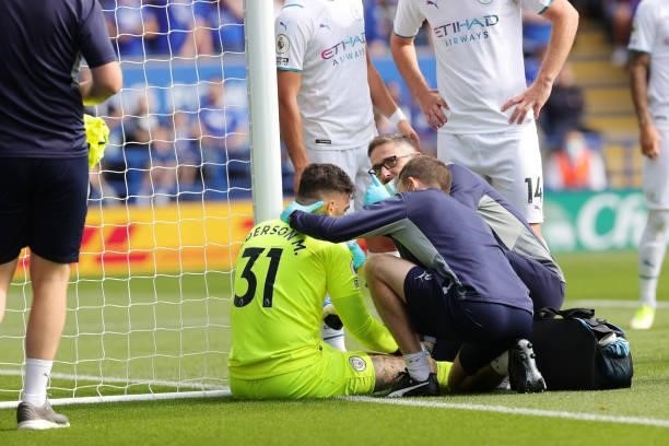 Ederson of Manchester City receives treatment during the Premier League match between Leicester City and Manchester City at King Power Stadium on...