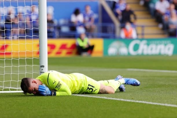 Ederson of Manchester City holds his face after colliding with Harvey Barnes of Leicester City during the Premier League match between Leicester City...