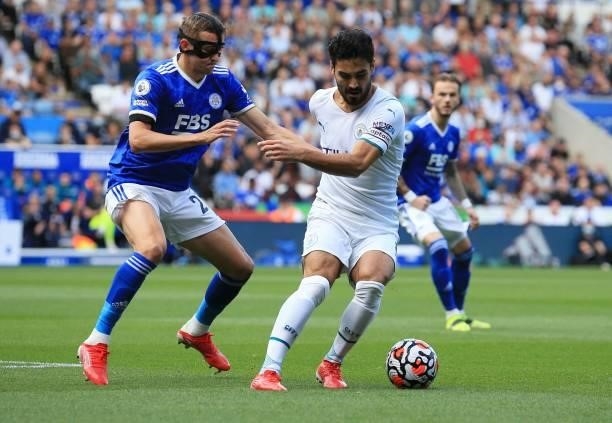 Leicester City's Belgian defender Timothy Castagne closes in on Manchester City's German midfielder Ilkay Gundogan during the English Premier League...