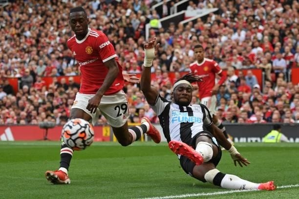 Newcastle United's French midfielder Allan Saint-Maximin crosses the ball during the English Premier League football match between Manchester United...