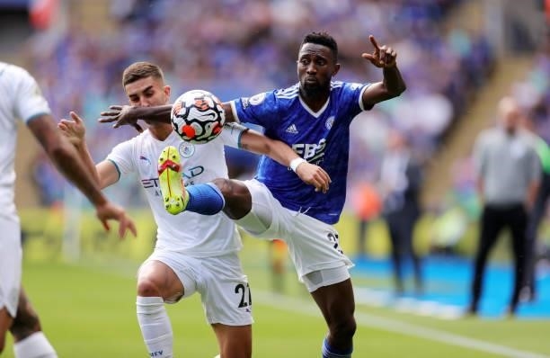Wilfred Ndidi of Leicester City in action with Ferrán Torres of Manchester City during the Premier League match between Leicester City and Manchester...
