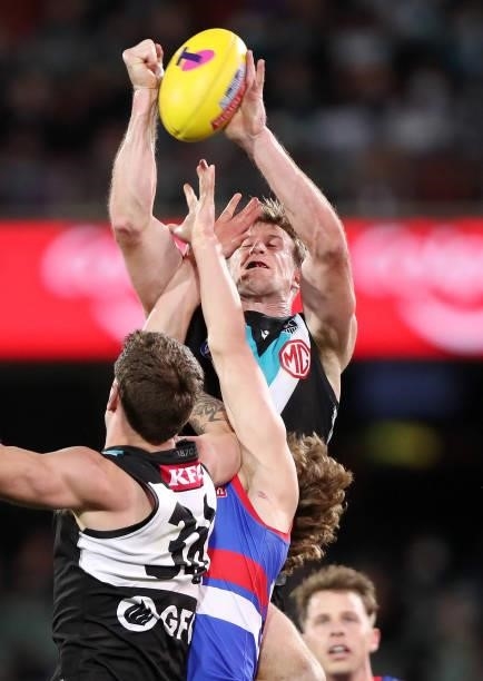 Tom Jonas of the Power punches the ball away during the 2021 AFL Second Preliminary Final match between the Port Adelaide Power and the Western...