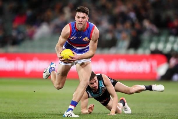 Bailey Williams of the Bulldogs and Orazio Fantasia of the Power during the 2021 AFL Second Preliminary Final match between the Port Adelaide Power...
