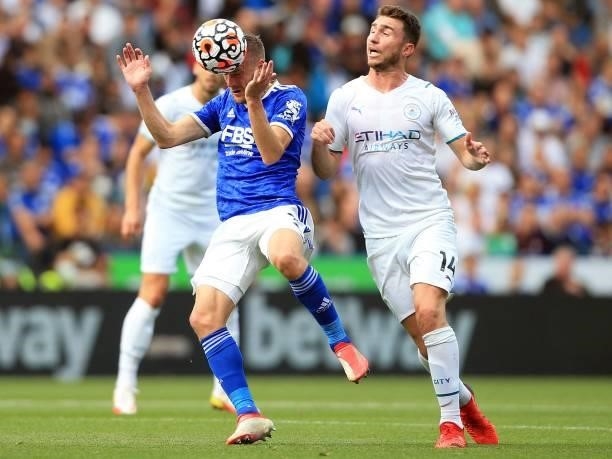 Leicester City's English striker Jamie Vardy heads he ball away from Manchester City's French defender Aymeric Laporte during the English Premier...