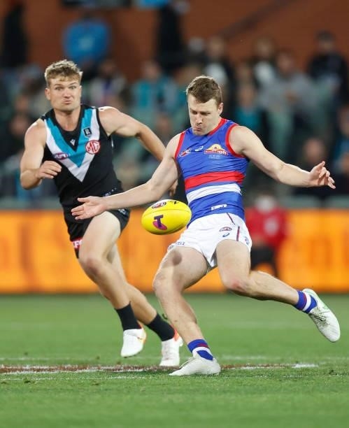 Jack Macrae of the Bulldogs kicks the ball during the 2021 AFL Second Preliminary Final match between the Port Adelaide Power and the Western...