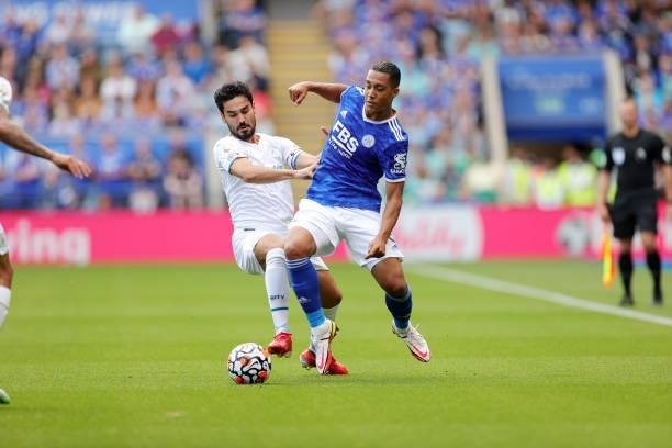 Youri Tielemans of Leicester City in action with lkay Gündoan of Manchester City during the Premier League match between Leicester City and...
