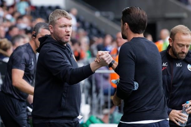 Hull City manager Grant McCann greets Swansea City manager Russell Martin during the Sky Bet Championship match between Swansea City and Hull City at...