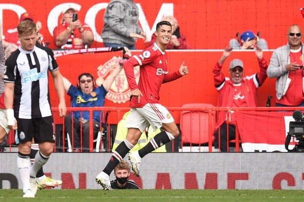Manchester United's Portuguese striker Cristiano Ronaldo celebrates after scoring the opening goal of the English Premier League football match...