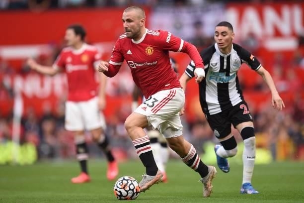 Manchester United's English defender Luke Shaw runs with the ball during the English Premier League football match between Manchester United and...