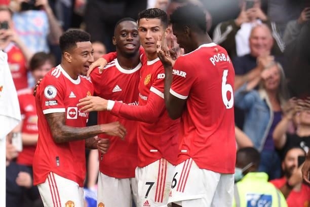 Manchester United's English midfielder Jesse Lingard celebrates with teammates after scoring their fourth goal during the English Premier League...