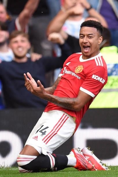 Manchester United's English midfielder Jesse Lingard celebrates after scoring their fourth goal during the English Premier League football match...