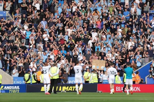 Manchester City fans celebrate after the Premier League match between Leicester City and Manchester City at King Power Stadium on September 11, 2021...