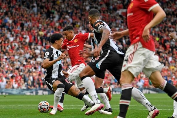 Manchester United's English midfielder Jesse Lingard runs through the Newcastle defence on his way to scoring their fourth goal during the English...