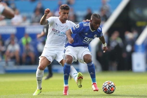 Joao Cancelo of Manchester City and Ademola Lookman of Leicester City during the Premier League match between Leicester City and Manchester City at...