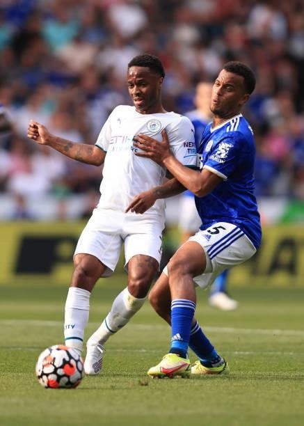 Raheem Sterling of Manchester City tangles with Ryan Bertrand of Leicester City during the Premier League match between Leicester City and Manchester...