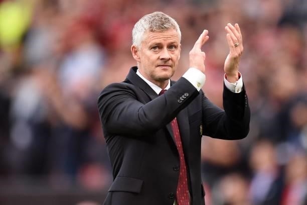 Manchester United's Norwegian manager Ole Gunnar Solskjaer applauds supporters as he leaves after the English Premier League football match between...