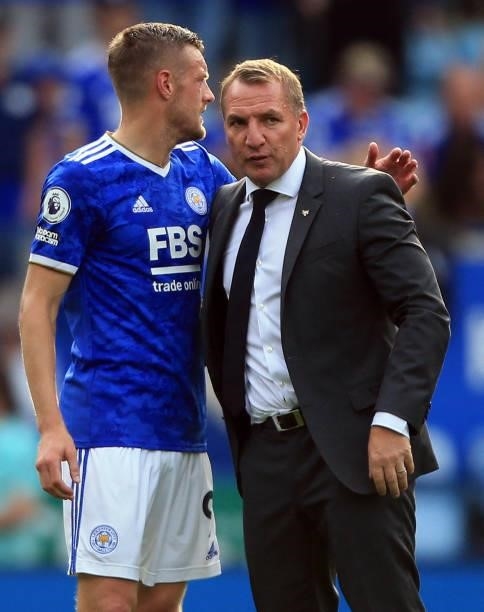 Leicester City's English striker Jamie Vardy embraces Leicester City's Northern Irish manager Brendan Rodgers after the English Premier League...