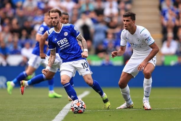 James Maddison of Leicester City in action with Rodrigo of Manchester City during the Premier League match between Leicester City and Manchester City...