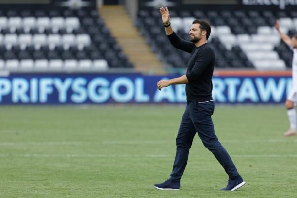 Swansea City manager Russell Martin waves to the home supporters after the final whistle during the Sky Bet Championship match between Swansea City...