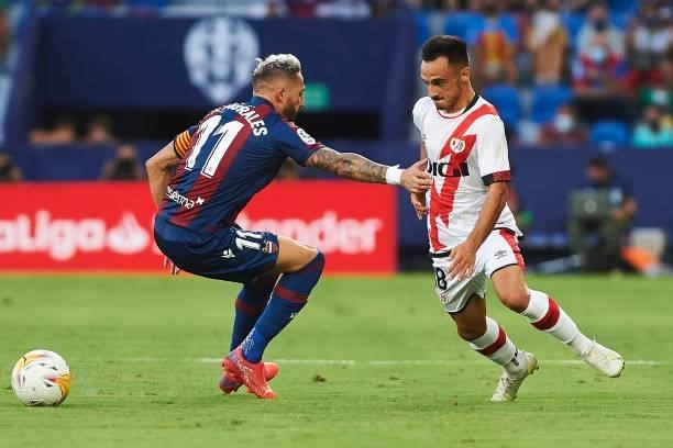 Jose Luis Morales of UD Levante and Oscar Trejo of Rayo Vallecano battle for the ball during the LaLiga Santander match between Levante UD and Rayo...
