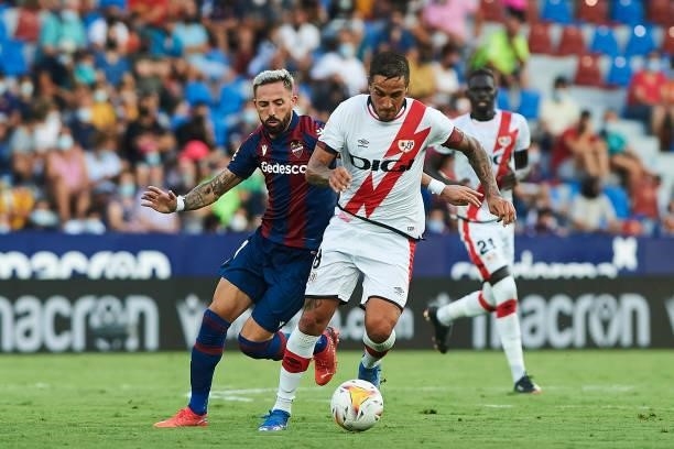 Jose Luis Morales of UD Levante and Oscar Trejo of Rayo Vallecano battle for the ball during the LaLiga Santander match between Levante UD and Rayo...