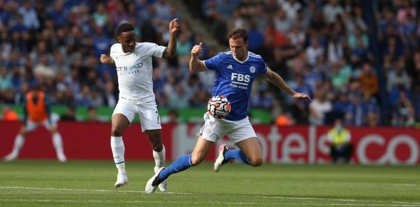 Leicester City's Jonny Evans battles with Manchester City's Raheem Sterling during the Premier League match between Leicester City and Manchester...