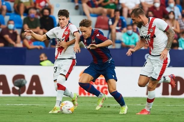 Dani Gomez of UD Levante and Fran Garcia of Rayo Vallecano battle for the ball during the LaLiga Santander match between Levante UD and Rayo...