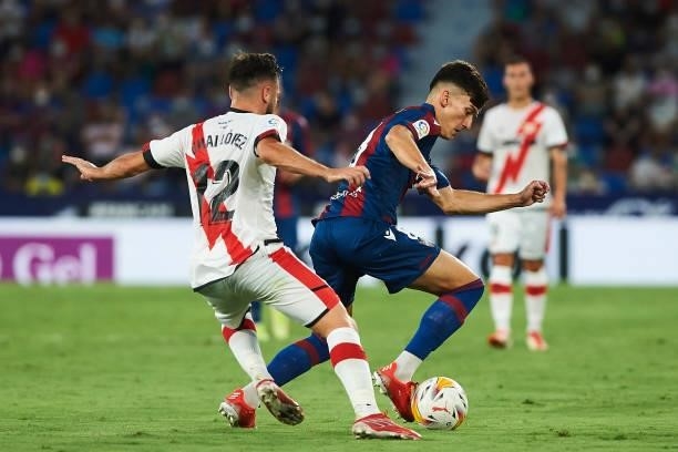 Jose Luis Garcia Vaya, Pepelu of UD Levante and Unai Lopez of Rayo Vallecano battle for the ball during the LaLiga Santander match between Levante UD...