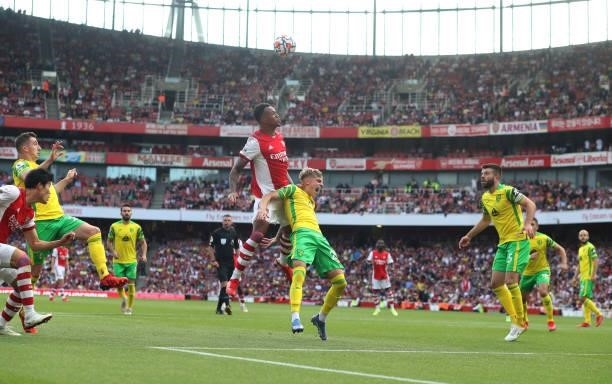 Gabriel of Arsenal jumps up to head the ball above Brandon Williams of Norwich City during the Premier League match between Arsenal and Norwich City...