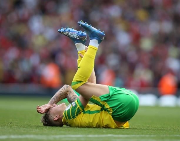 Brandon Williams of Norwich falls on his back after an injury during the Premier League match between Arsenal and Norwich City at Emirates Stadium on...